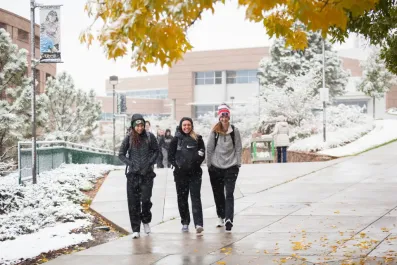 Students walk on a wintery campus