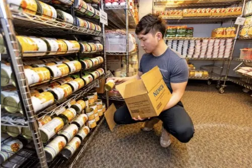 Staff working in the Basic Needs Center food pantry